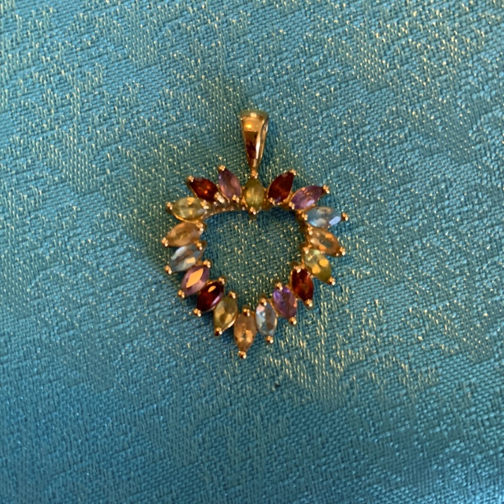 Beautiful multi colored stone heart pendant.